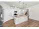 Bright kitchen featuring an island and stainless steel appliances at 5007 Grand Champion Ct, Iron Station, NC 28080