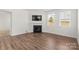 Living room with fireplace and hardwood floors at 5007 Grand Champion Ct, Iron Station, NC 28080