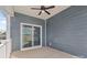 Covered porch with sliding glass doors and ceiling fan at 5007 Grand Champion Ct, Iron Station, NC 28080