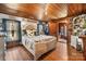 Cozy bedroom with rustic wood floors and a comfortable bed at 673 Cape Hickory Rd, Hickory, NC 28601