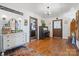 Bright entryway with hardwood floors, antique furniture, and piano at 673 Cape Hickory Rd, Hickory, NC 28601