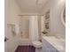 Clean bathroom with white vanity and dark tile floors at 6922 Concord Hwy, Monroe, NC 28110