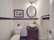 Elegant powder room with pedestal sink and dark vanity at 6922 Concord Hwy, Monroe, NC 28110