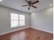 Bright bedroom with hardwood floors and large window at 6922 Concord Hwy, Monroe, NC 28110
