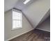 Bonus room with sloped ceilings and a large window at 6922 Concord Hwy, Monroe, NC 28110
