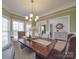 Elegant dining room with large windows and a wooden table at 6922 Concord Hwy, Monroe, NC 28110