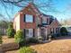 Two story brick home with landscaping and a walkway at 6922 Concord Hwy, Monroe, NC 28110