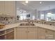 Kitchen features a breakfast bar and hexagon tile backsplash at 6922 Concord Hwy, Monroe, NC 28110