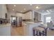 Modern kitchen with white cabinets, stainless steel appliances and breakfast bar at 6922 Concord Hwy, Monroe, NC 28110