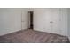 Bright bedroom with neutral carpeting and double doors at 804 Pierce Ave, Mount Holly, NC 28120