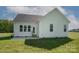 Rear view of house with patio and grassy yard at 804 Pierce Ave, Mount Holly, NC 28120