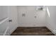 Laundry room with vinyl flooring and built-in shelving at 804 Pierce Ave, Mount Holly, NC 28120