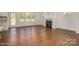 Open living area with hardwood floors, fireplace, and backyard access at 804 Pierce Ave, Mount Holly, NC 28120