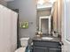 Full bathroom with shower/tub combo and granite vanity at 871 Academy St, Charlotte, NC 28205