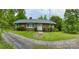 Brick ranch house with a gravel driveway and walkway at 931 Skyline Dr, Chester, SC 29706