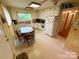 Eat-in kitchen with white cabinets and vinyl flooring at 931 Skyline Dr, Chester, SC 29706