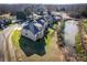Aerial view of home showcasing neighborhood and pond at 1033 12Th Avenue Nw Dr, Hickory, NC 28601
