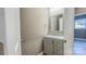 Small bathroom with gray vanity and a framed mirror at 1033 12Th Avenue Nw Dr, Hickory, NC 28601