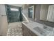 Main bathroom with double vanity and hexagonal tile at 1033 12Th Avenue Nw Dr, Hickory, NC 28601