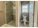 Bathroom with toilet and walk-in shower at 1033 12Th Avenue Nw Dr, Hickory, NC 28601