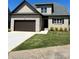 Charming brick home featuring a two-car garage, manicured lawn, and a welcoming entrance at 1033 12Th Avenue Nw Dr, Hickory, NC 28601