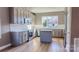 Modern kitchen with grey cabinets, white backsplash, and quartz countertops at 1033 12Th Avenue Nw Dr, Hickory, NC 28601