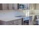 Modern kitchen with grey cabinets and stainless steel appliances at 1033 12Th Avenue Nw Dr, Hickory, NC 28601