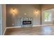 Living room featuring a modern fireplace and wood-look floors at 1033 12Th Avenue Nw Dr, Hickory, NC 28601