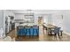 Eat-in kitchen with island, farmhouse table and light blue accents at 1197 Zion Church Rd, Hickory, NC 28602