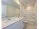 Bathroom with double sinks and a bathtub shower combo at 1412 Windy Park Dr, Stanley, NC 28164