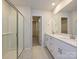 Modern bathroom with double vanity, shower, and walk-in closet at 1412 Windy Park Dr, Stanley, NC 28164