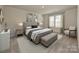Large bedroom with plush bed, neutral decor and ample natural light at 1412 Windy Park Dr, Stanley, NC 28164
