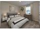 Secondary bedroom with comfortable bed and a dresser at 1412 Windy Park Dr, Stanley, NC 28164