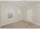 Spacious bedroom featuring neutral walls, carpet, and ample natural light at 19054 Long Pond Ln, Cornelius, NC 28031