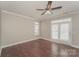 Bright bedroom with hardwood floors and access to backyard at 19054 Long Pond Ln, Cornelius, NC 28031