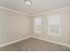 Bright bedroom with neutral walls, carpet, and two large windows at 19054 Long Pond Ln, Cornelius, NC 28031