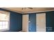 Blue bedroom with window, ceiling fan, and two doors at 3169 Eden Terrace Ext, Rock Hill, SC 29730