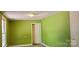 Green-walled bedroom with a closet and large window at 3169 Eden Terrace Ext, Rock Hill, SC 29730