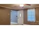 Living room with gray walls, white door, and window coverings at 3169 Eden Terrace Ext, Rock Hill, SC 29730