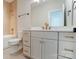 Modern bathroom with a white vanity, gold fixtures, and a tiled bathtub and shower combination at 3432 Greene Rd, Monroe, NC 28110