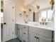 Bathroom featuring double sinks, granite countertops and modern fixtures at 3432 Greene Rd, Monroe, NC 28110
