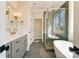 Modern bathroom featuring a freestanding tub, a shower, and double vanity sinks at 3432 Greene Rd, Monroe, NC 28110