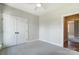 Neutral bedroom featuring soft carpet, a ceiling fan, and a door leading to another room at 3432 Greene Rd, Monroe, NC 28110