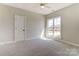 Bright bedroom featuring a window with views of the outside and soft, neutral carpeting at 3432 Greene Rd, Monroe, NC 28110