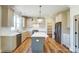 A modern kitchen with an island, stainless steel appliances and wooden floors at 3432 Greene Rd, Monroe, NC 28110