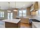 Open kitchen featuring a kitchen island, stainless appliances and access to outdoor living at 3432 Greene Rd, Monroe, NC 28110