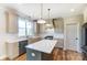 A modern kitchen featuring white countertops and wooden floors at 3432 Greene Rd, Monroe, NC 28110