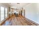 Bright kitchen with island, stainless appliances, hardwood floors and access to outdoor porch at 3432 Greene Rd, Monroe, NC 28110
