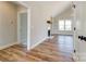 Bright, modern living room with wood floors, fireplace, and large windows providing natural light at 3432 Greene Rd, Monroe, NC 28110