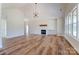 Bright open-concept living space with wood floors, modern lighting, and a cozy fireplace feature at 3432 Greene Rd, Monroe, NC 28110